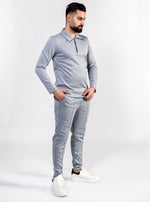 Twee delige poloshirt met lange mouwen en herringbone pantalon