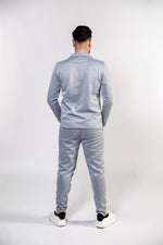 Twee delige poloshirt met lange mouwen en herringbone pantalon